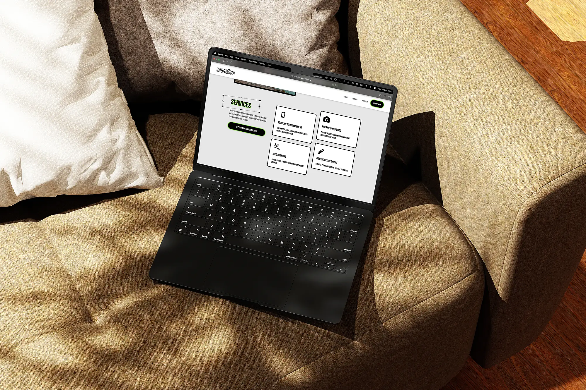A laptop on a couch displaying the "Services" section of the Inventiva agency website, featuring minimalist icons and clear service descriptions.