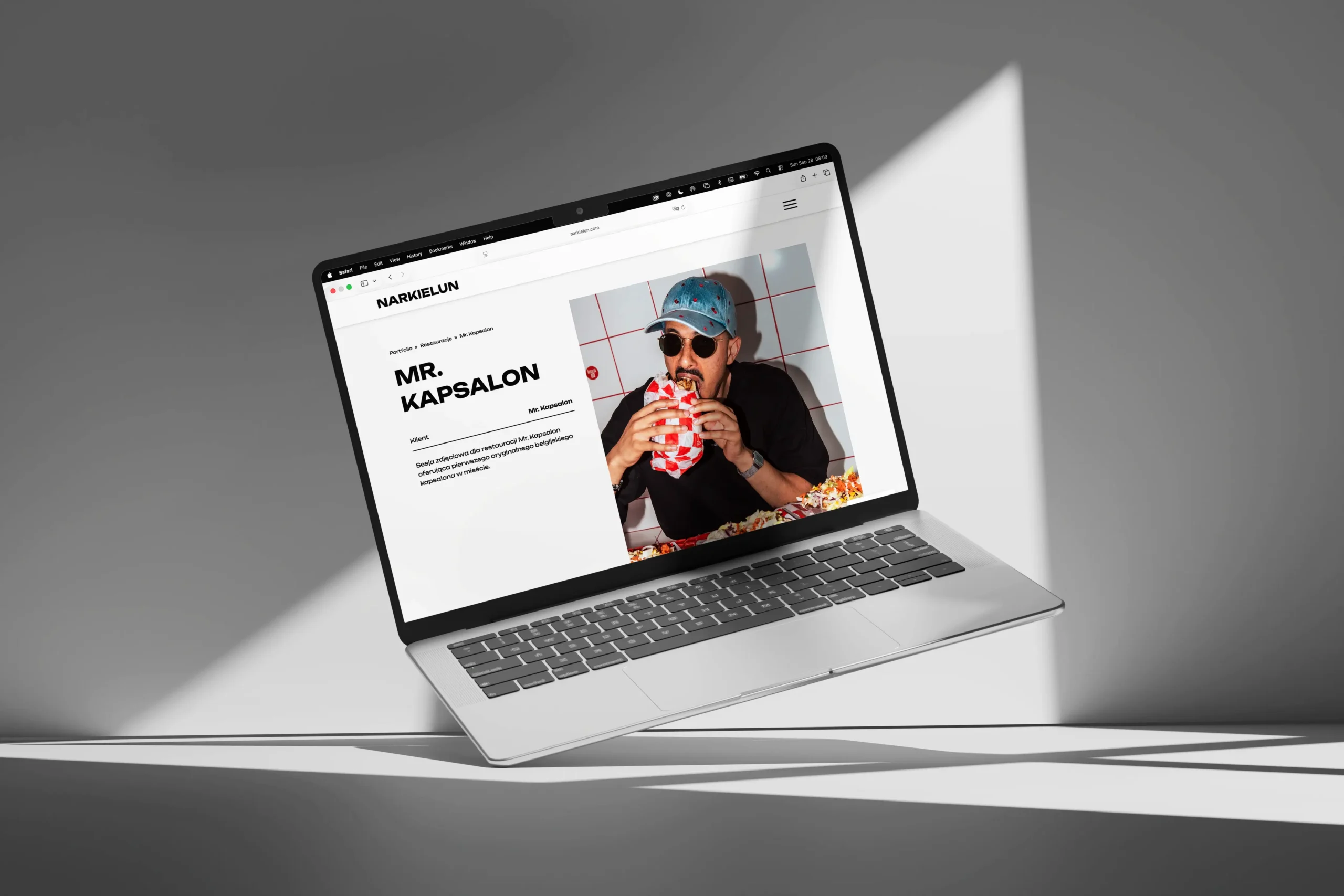 Laptop screen displaying a project detail page for Mr. Kapsalon on Jacek Narkielun’s portfolio website, featuring a portrait of a man eating a sandwich, presented in a minimalist, editorial layout.